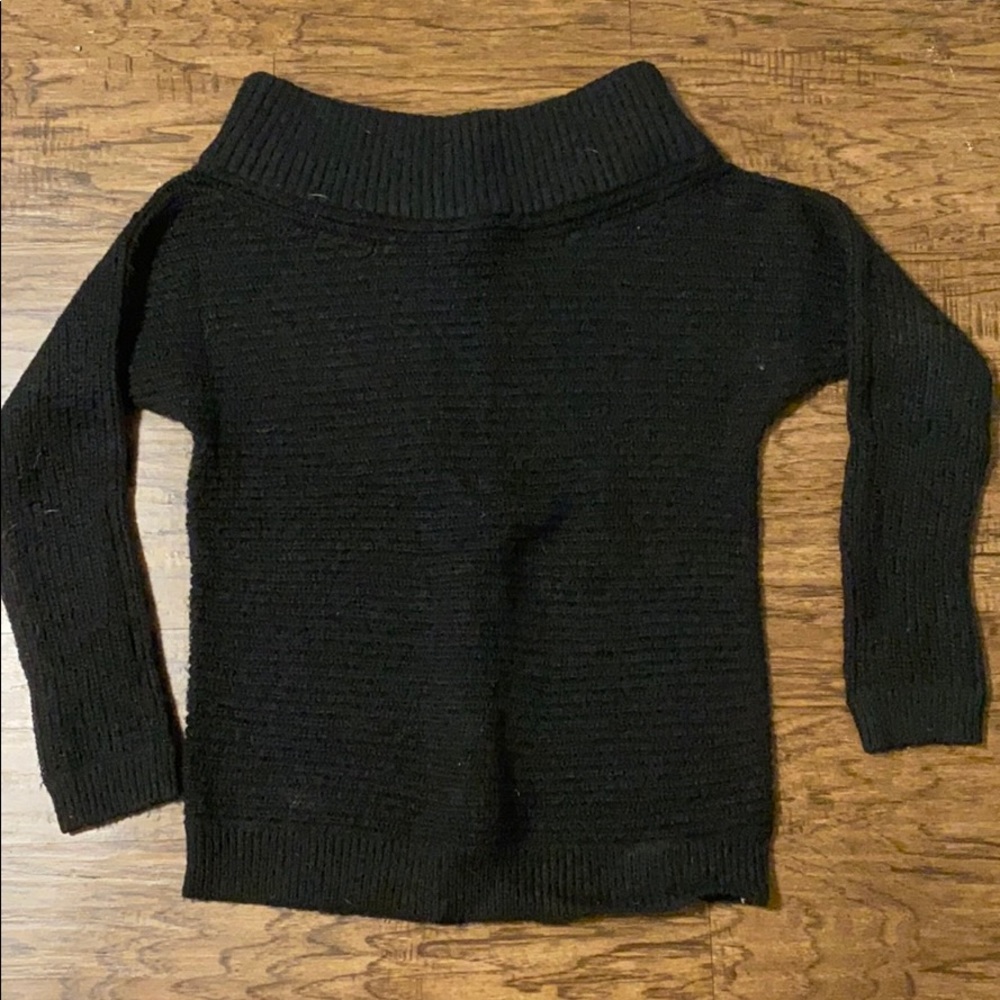Express knot across the shoulder sweater